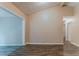 Bright, open-concept living room showcasing gray wood flooring, large windows, and neutral-toned walls at 2469 Newgate Dr, Decatur, GA 30035