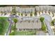 A high-angle shot showcases townhomes, neatly aligned, with landscaping and street views at 2647 Sardis Chase Ct, Buford, GA 30519