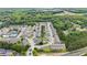 This aerial view features a leafy townhome community with mature trees and ample parking at 2647 Sardis Chase Ct, Buford, GA 30519