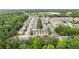 An aerial view shows a beautiful neighborhood with lush trees and well-maintained townhome community at 2647 Sardis Chase Ct, Buford, GA 30519