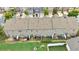 A backyard view shows patio, greenspace, and privacy fence of townhome at 2647 Sardis Chase Ct, Buford, GA 30519