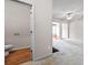 Half bathroom next to an open room with carpet flooring at 2647 Sardis Chase Ct, Buford, GA 30519