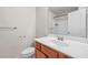 Bathroom vanity with wood cabinets, a white countertop, and a large mirror at 2647 Sardis Chase Ct, Buford, GA 30519