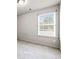 Bedroom with neutral walls, carpet floors, and a window with natural light at 2647 Sardis Chase Ct, Buford, GA 30519