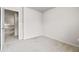 Open door showing a carpeted bedroom with neutral walls, offering a peek into the hallway at 2647 Sardis Chase Ct, Buford, GA 30519