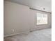 Neutral bedroom featuring carpet flooring, a window with blinds, and freshly painted walls at 2647 Sardis Chase Ct, Buford, GA 30519