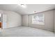 Bedroom with carpet flooring, a large window, and an ensuite bathroom at 2647 Sardis Chase Ct, Buford, GA 30519