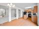 Open kitchen featuring wood cabinets, black appliances, granite countertops, and hardwood flooring at 2647 Sardis Chase Ct, Buford, GA 30519