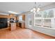 Bright kitchen with hardwood floors, island, and ample cabinet space at 2647 Sardis Chase Ct, Buford, GA 30519