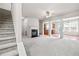 Spacious living room featuring a fireplace, neutral carpet, and open concept design at 2647 Sardis Chase Ct, Buford, GA 30519