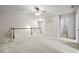 Second floor loft with neutral walls, carpet flooring, and traditional railing at 2647 Sardis Chase Ct, Buford, GA 30519