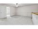 Second floor loft with neutral walls, carpet flooring, and ceiling fan at 2647 Sardis Chase Ct, Buford, GA 30519