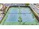 Overhead view shows community tennis courts with green surface and black net at 2647 Sardis Chase Ct, Buford, GA 30519