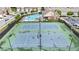 Aerial view of two tennis courts, a community pool, and the clubhouse, surrounded by well-maintained landscaping at 2647 Sardis Chase Ct, Buford, GA 30519