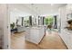 Bright open kitchen flows into a living area, showcasing granite countertops and stainless steel appliances at 720 Hedwig Dr, Mcdonough, GA 30252