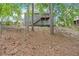 A beautiful two-story home with a private backyard and mature trees and wooden fence at 10 Bayberry Ct, Acworth, GA 30101