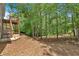 View of wooded backyard from wooden deck with stairs at 10 Bayberry Ct, Acworth, GA 30101
