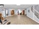 An open basement area with laminate flooring featuring neutral walls, workout equipment, and stairs at 10 Bayberry Ct, Acworth, GA 30101