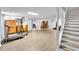Spacious basement featuring a laminate floor, workout equipment, and access to additional rooms at 10 Bayberry Ct, Acworth, GA 30101