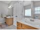 Double vanity bathroom with tile flooring, white cabinets, and great lighting at 10 Bayberry Ct, Acworth, GA 30101
