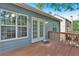 Outdoor deck with wooden railing and siding, overlooking the backyard and lush green trees at 10 Bayberry Ct, Acworth, GA 30101
