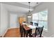 Dining area with hardwood flooring, chandelier, and large windows for ample natural light at 10 Bayberry Ct, Acworth, GA 30101