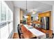 Bright dining area with wood table and chairs, chandelier, and view into the kitchen at 10 Bayberry Ct, Acworth, GA 30101