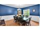 Dining Room features dark-blue walls, crown moulding, hardwood floors, and traditional decor at 10 Bayberry Ct, Acworth, GA 30101