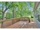 Enjoy the outdoors on this deck overlooking a tranquil, tree-lined yard at 10 Bayberry Ct, Acworth, GA 30101