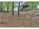 Back of house with a deck and stairs and attractive landscaping at 10 Bayberry Ct, Acworth, GA 30101