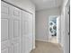 Hallway with a closet and view into a bathroom with a blue patterned shower curtain at 10 Bayberry Ct, Acworth, GA 30101