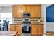 Updated kitchen with stainless steel appliances, maple cabinets, granite counters, and a tile backsplash at 10 Bayberry Ct, Acworth, GA 30101