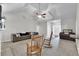 Bright living room with vaulted ceilings, plush sofa, and wood rocking chairs creates a welcoming atmosphere at 10 Bayberry Ct, Acworth, GA 30101
