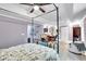 Main bedroom with a stylish bed and a cozy seating area at 10 Bayberry Ct, Acworth, GA 30101