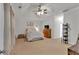 Spacious main bedroom with a tray ceiling, ceiling fan, and neutral carpeting at 10 Bayberry Ct, Acworth, GA 30101