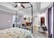 A serene main bedroom with a four-poster bed and view of an office area at 10 Bayberry Ct, Acworth, GA 30101