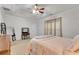Main bedroom featuring a large bed, dresser, mirror, and natural light at 10 Bayberry Ct, Acworth, GA 30101