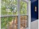 A view of trees and a deck from a window at 10 Bayberry Ct, Acworth, GA 30101