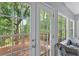 A view of a wood deck and trees from a window and glass doors at 10 Bayberry Ct, Acworth, GA 30101