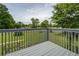 View from the back deck with grey wooden rails overlooking a spacious grassy yard at 2821 Highway 11, Mansfield, GA 30055