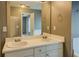 Bathroom with double sinks and a large mirror reflects the shower and soaking tub in this light, open space at 2821 Highway 11, Mansfield, GA 30055