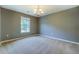 Bedroom with neutral walls, carpet and window providing natural light at 2821 Highway 11, Mansfield, GA 30055