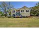 Charming two-story home with a well-manicured lawn and welcoming front porch at 2821 Highway 11, Mansfield, GA 30055
