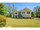 Charming two-story home with stone accents, inviting front porch and mature trees at 2821 Highway 11, Mansfield, GA 30055