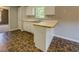 Well-equipped kitchen with tile flooring, a breakfast bar, and modern appliances at 2821 Highway 11, Mansfield, GA 30055