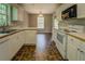 Efficient kitchen featuring white cabinets, modern appliances, and tile flooring at 2821 Highway 11, Mansfield, GA 30055