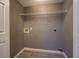 Laundry room with modern flooring, utility connections, and fresh paint for a clean and functional space at 2821 Highway 11, Mansfield, GA 30055