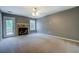Cozy living room with a stone fireplace and glass doors leading to the outside at 2821 Highway 11, Mansfield, GA 30055
