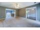 Open-concept living room with neutral walls and carpeting, great for entertaining at 2821 Highway 11, Mansfield, GA 30055