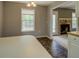 Well-lit living room view into the eat in area, featuring tile floor and windows at 2821 Highway 11, Mansfield, GA 30055